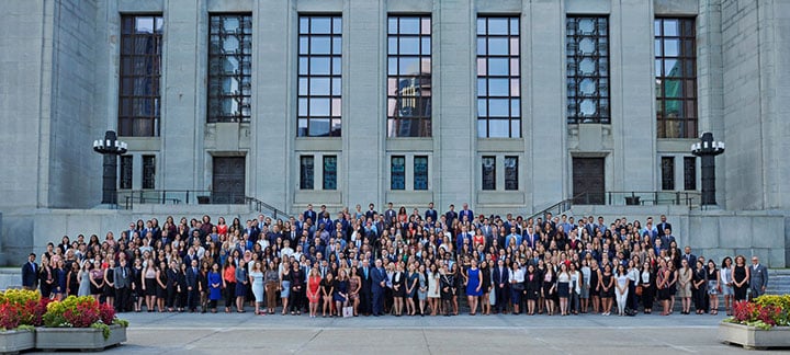 Law students and faculty members posing in front of UOttawa Law School